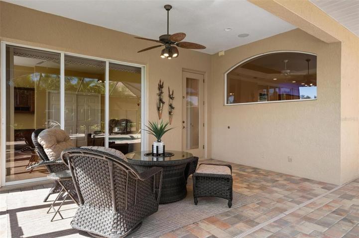 One of two under roof cabanas. Door to pool bath, sliding door to den