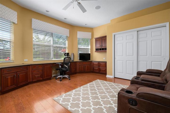 Office/study/den - Beautiful built-in cabinets with desk and granite countertops, expansive views of golf course. (Bedroom 4)