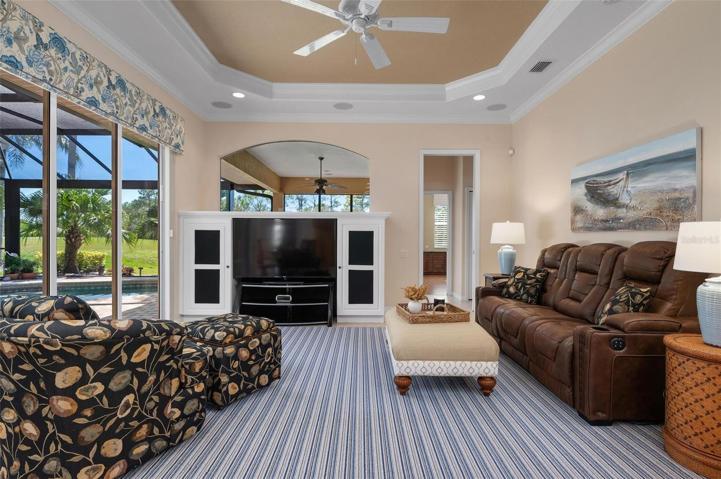 Family room with volume ceiling and crown molding