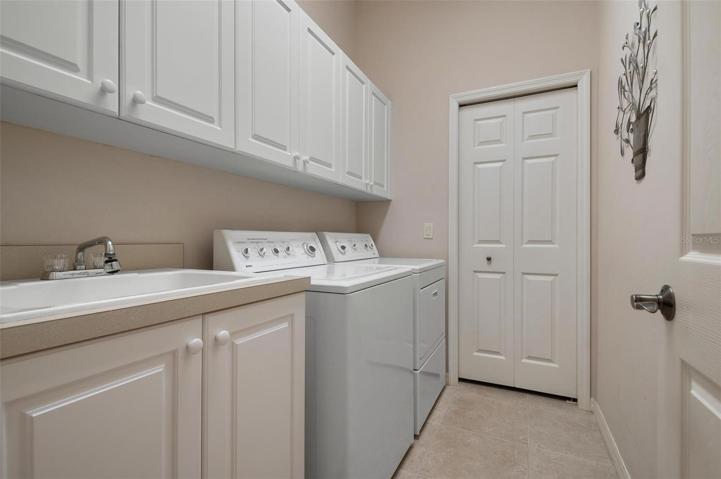 Laundry room with storage closet