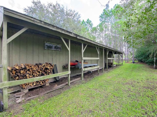 Backside of Barn/workshop 68x14 - view from the property line toward barn