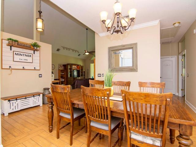 Foyer, dining room and view to primary bedroom suite to the right