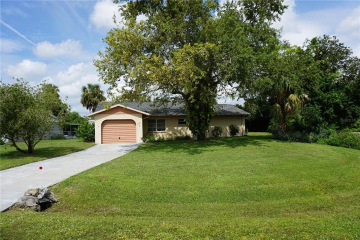 Located on an oversized corner lot in the heart of Port Charlotte
