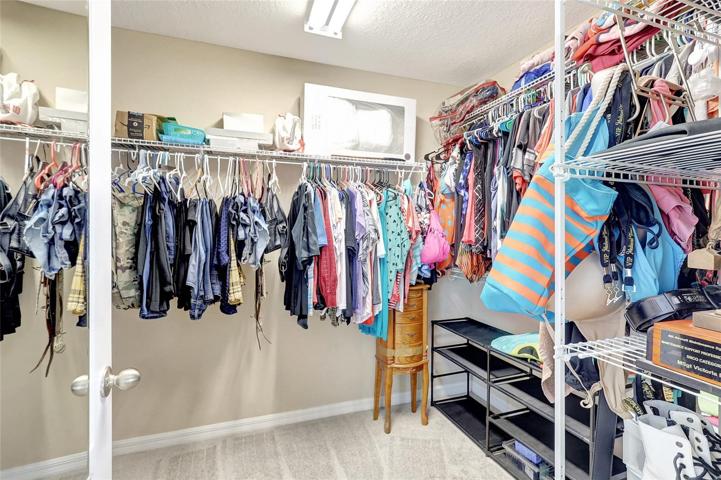 Walk-in closet primary bedroom