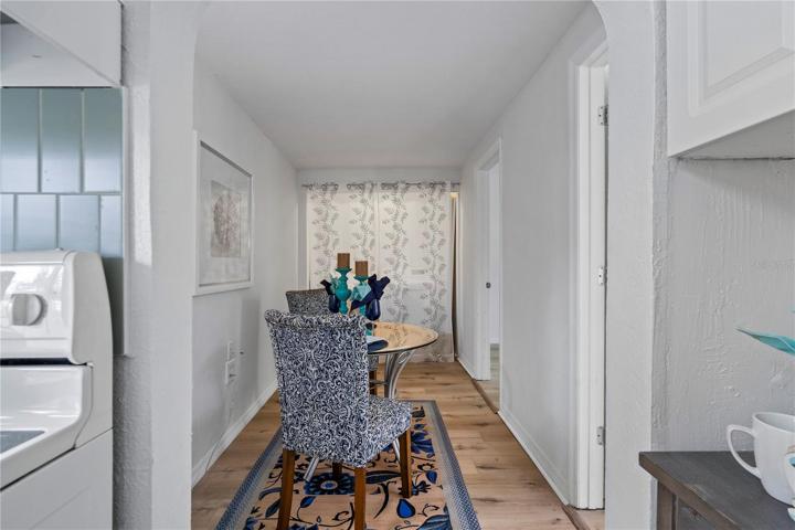 Dining Area w/ Laundry Closet behind Curtains