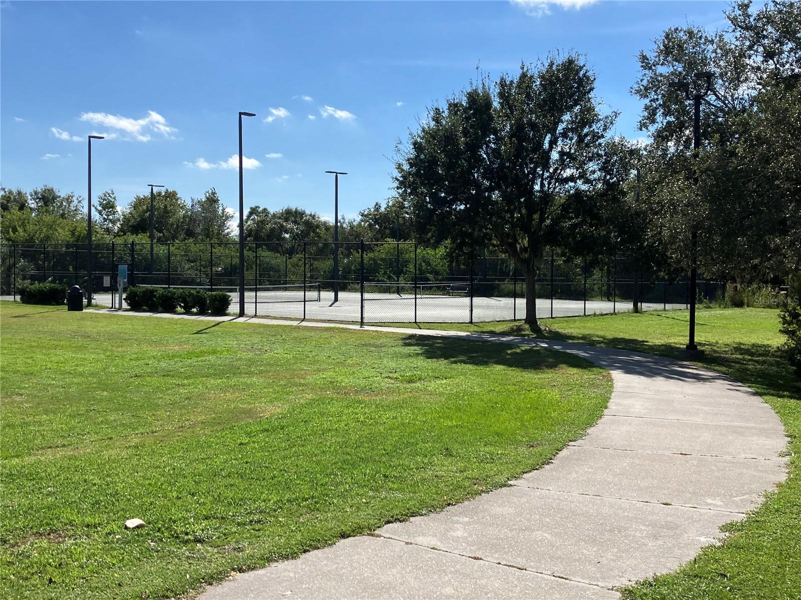 Lighted tennis courts at Univ. Park Community Park.