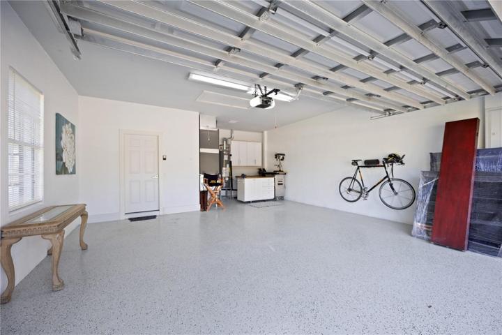 Newly paint epoxy garage floor...space for two cars and a work shop area.