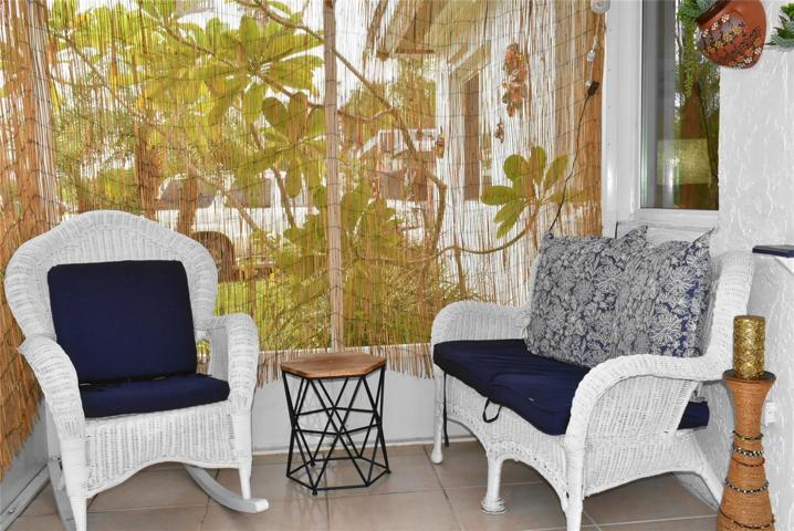 Front porch - covered and screened.