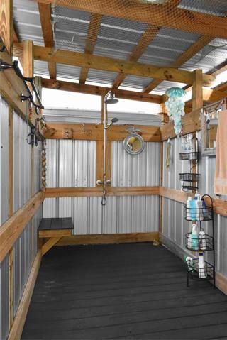 Outdoor shower has hot and cold running water.