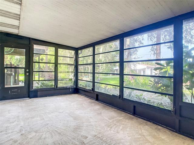 screened porch leads to pool