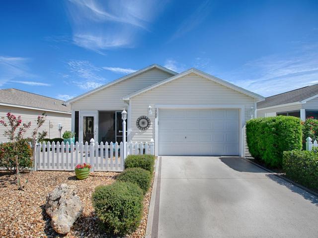 LOVELY CURB APPEAL AND LOW MAINTENANCE ON THIS 2/2 "COLONY" PATIO VILLA IN THE VILLAGE OF BUTTONWOOD.