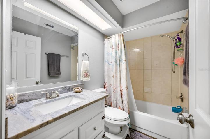 Hall bath for secondary bedrooms   and house guests. Granite countertop