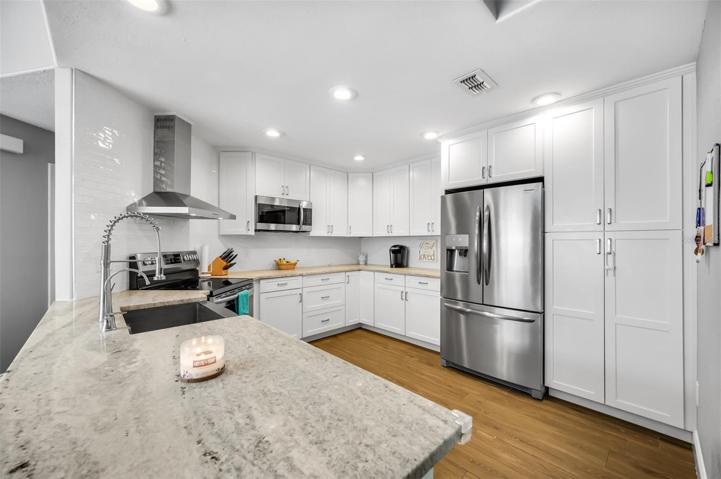 Bright and classy kitchen with granite countertops