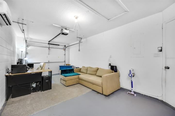 Over-sized one car garage recognized as conditioned space by property appraiser. Can easily be used as such or as garage.