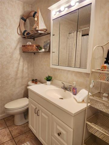 Bath, features tub with shower