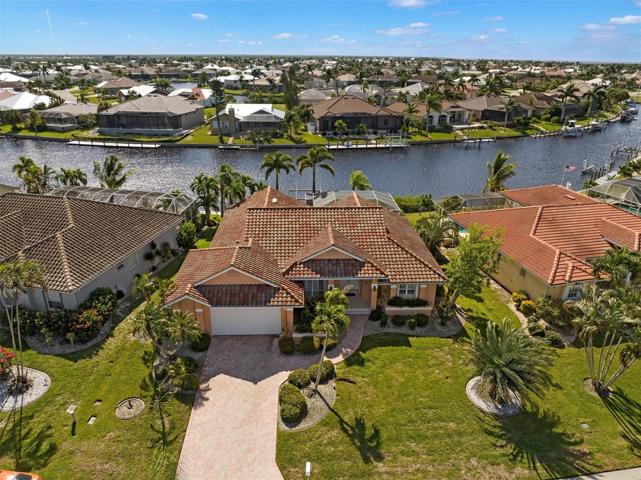 1277 Pine Siskin Dr.--PGI, pool home on an expansive, sailboat access canal