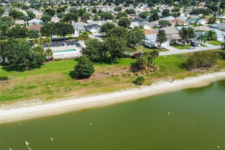 Arial View of RC Boats in Water with Home in View