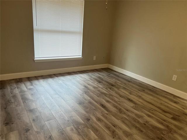 Master bedroom featuring new laminate flooring