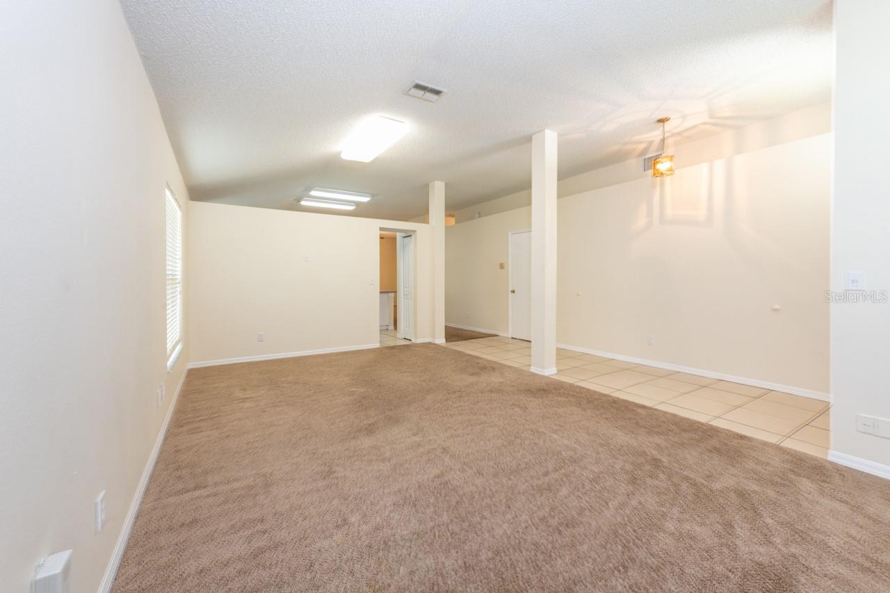 Formal living/dining with an entry into the kitchen.