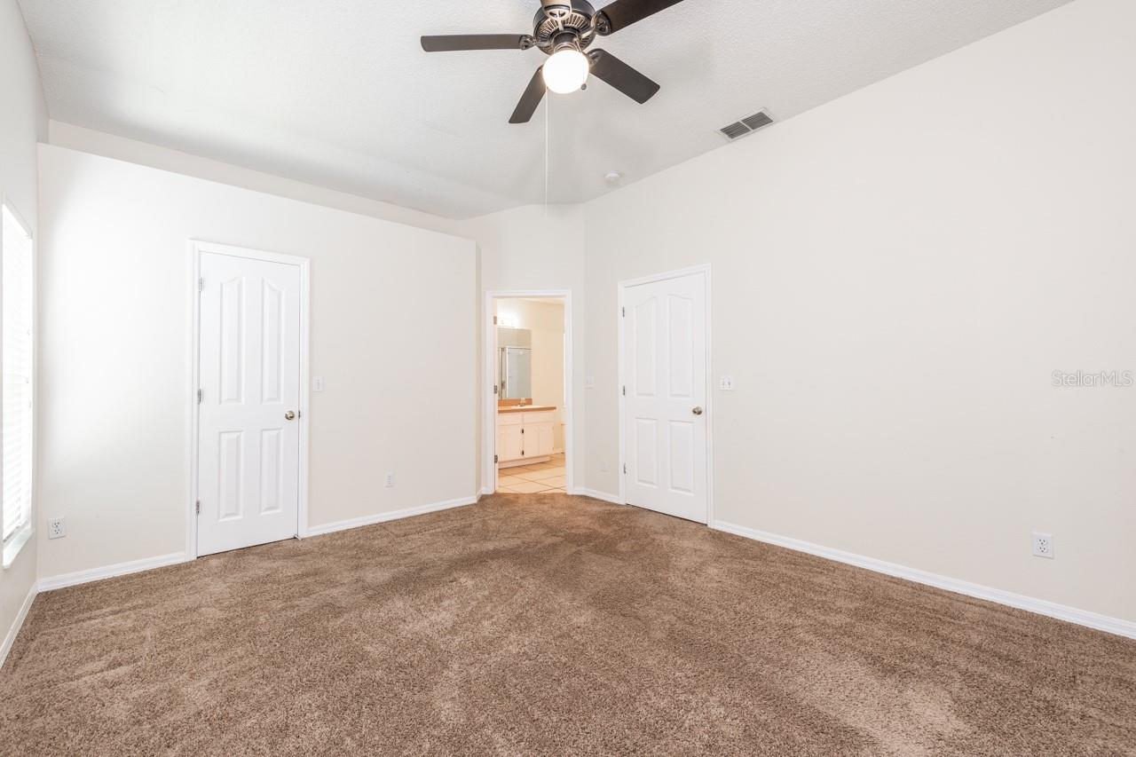 Master bedroom with an ensuite bath