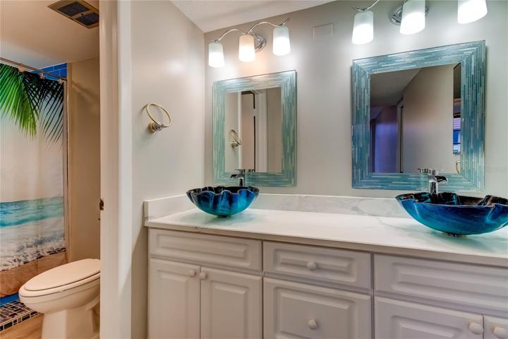 Dual bowl sinks in Master bath with separate shower area