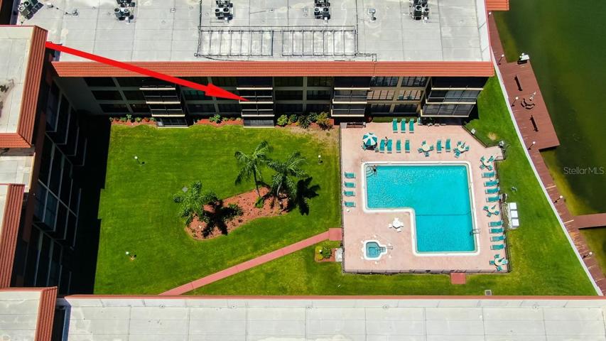 Balcony view of Large community pool with separatejacuzzi