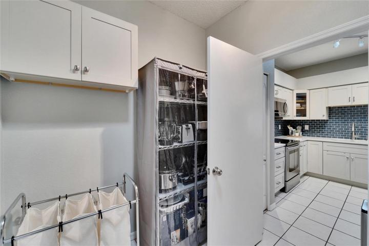 Laundry room with view of the Kitchen.