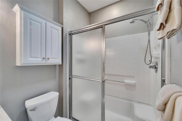 Three piece bath with walk in shower.