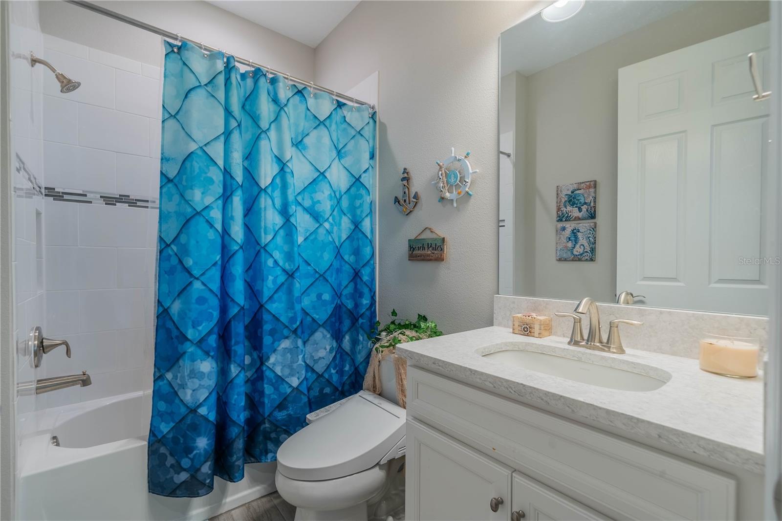 Down Stairs Full Bathroom, Quartz Vanity and Tiled Tub/Shower
