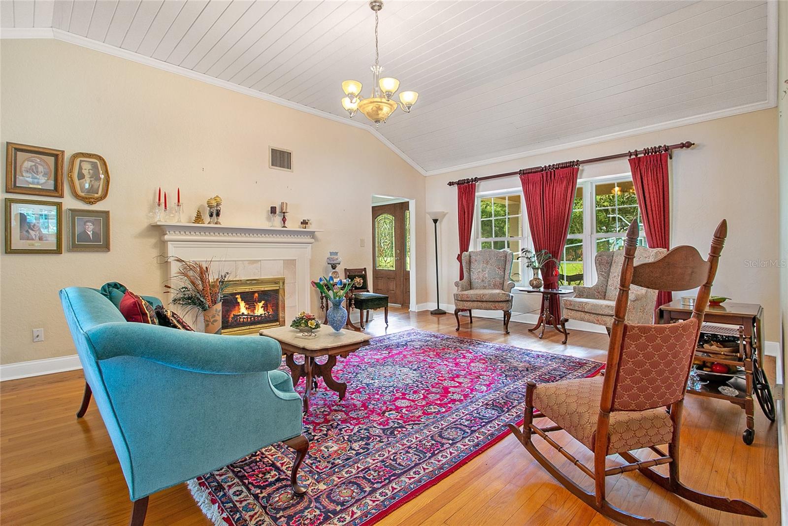 Living room with one of two fireplaces.