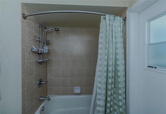 tub/shower combination in the guest bath