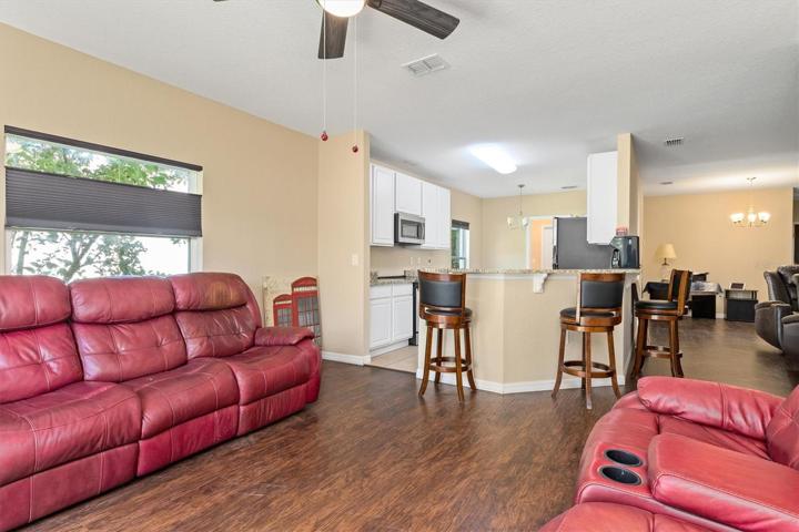 Family room looking into kitchen and livingroom