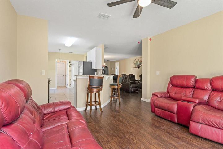 Family room looking into kitchen and living room