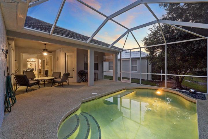 Screened-in lanai featuring a heated saltwater pool, rubber tec decking, and preserve views. NEW Pool Pump, NEW Pool Filter Canister, and New Salt Cell.