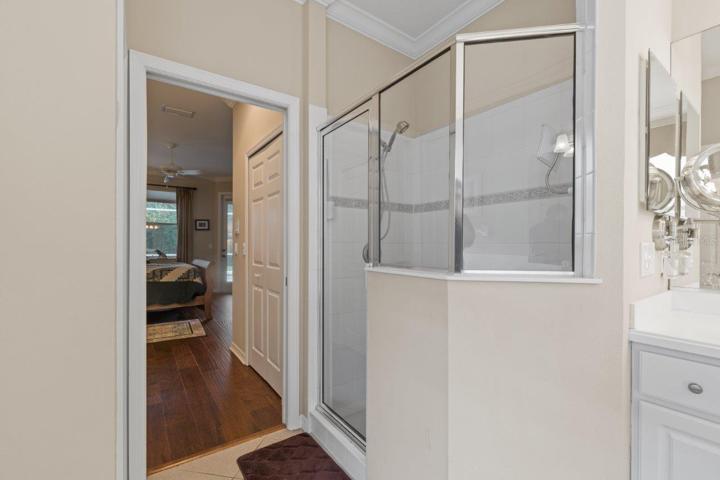 Owners ensuite bathroom featuring dual sinks, a garden tub, and walk-in shower.