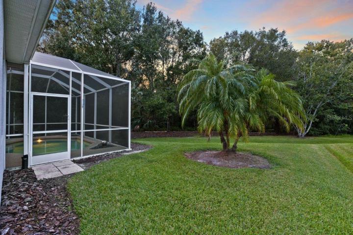 Back yard featuring a new invisible fence, and preserve view!
