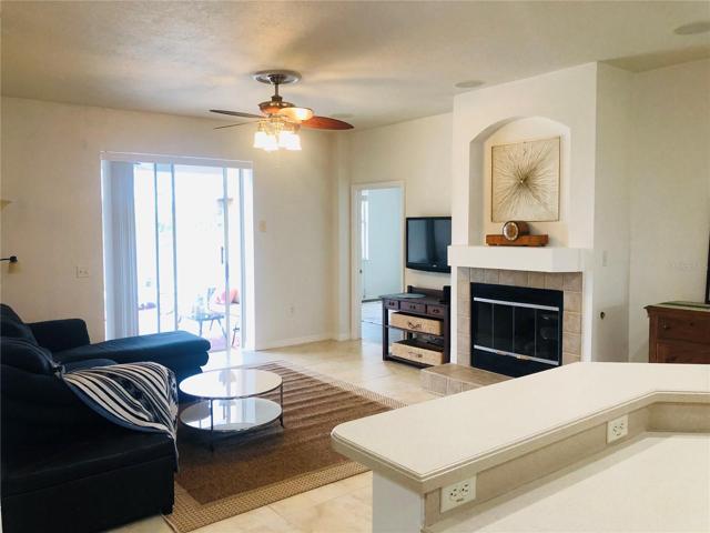 Kitchen looks out to family room and pool area.
