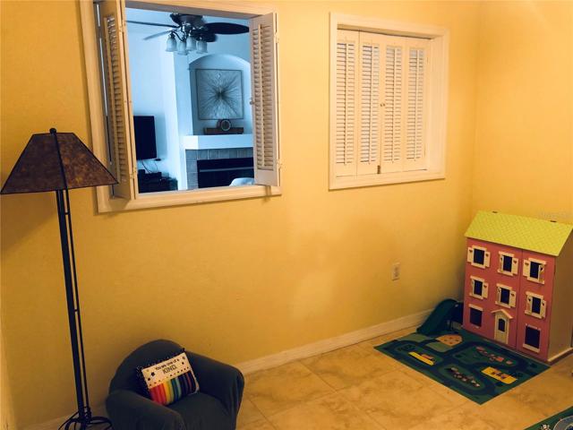 Shutters can open between flex room and family room.