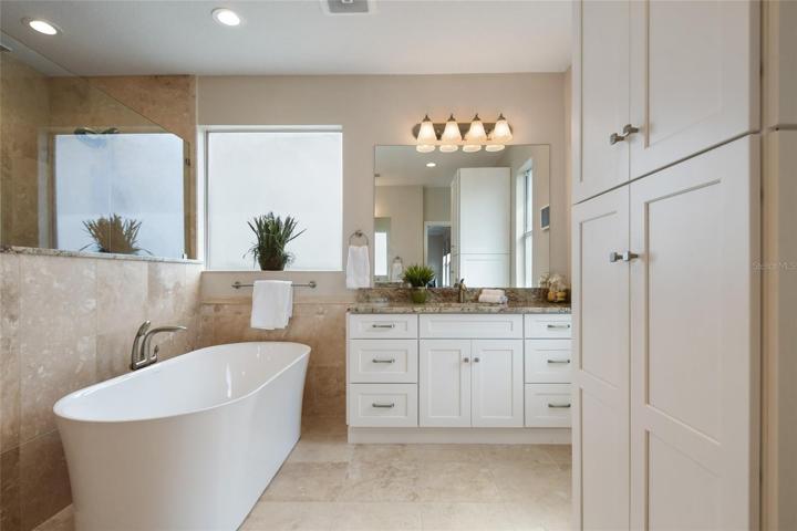 Extra storage in master bathroom is found in the additional stand alone tower cabinet provides room for towels, cleaning supplies and linens.