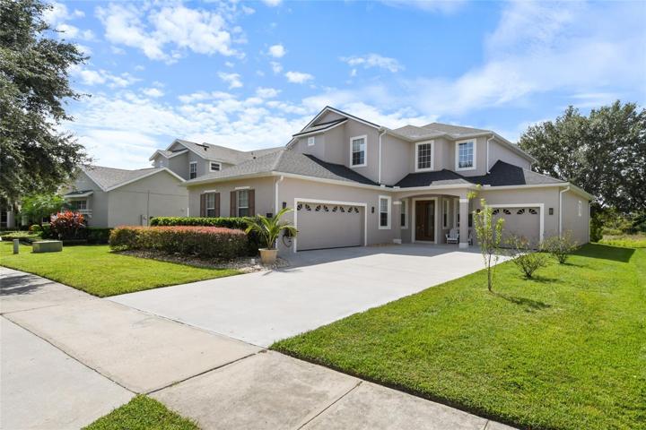 Total of 3 garages, one oversized 2 car garage supported by separate one car garage to the right