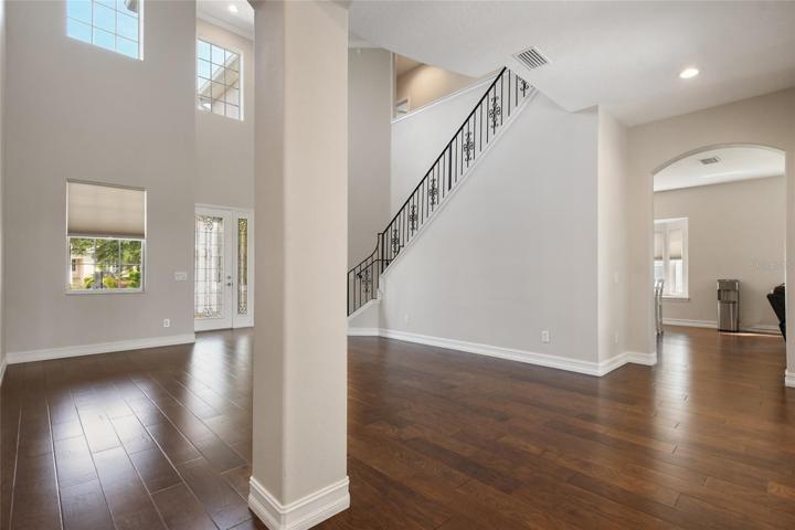 While standing with your back to the flex room you get the view across the living room to the kitchen/family room area.