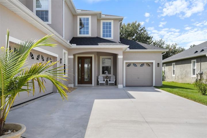 Huge driveway supports plenty of out door parking for guests or a place for the kids to play
