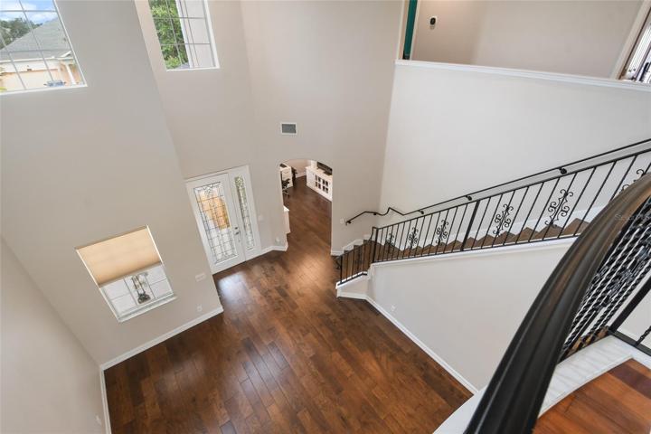 View from the Master bedroom balcony overlooking the two story living room and foyer.