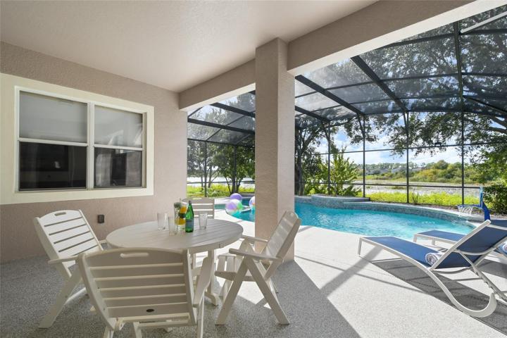 Covered lanai area provides shade for outside dining.