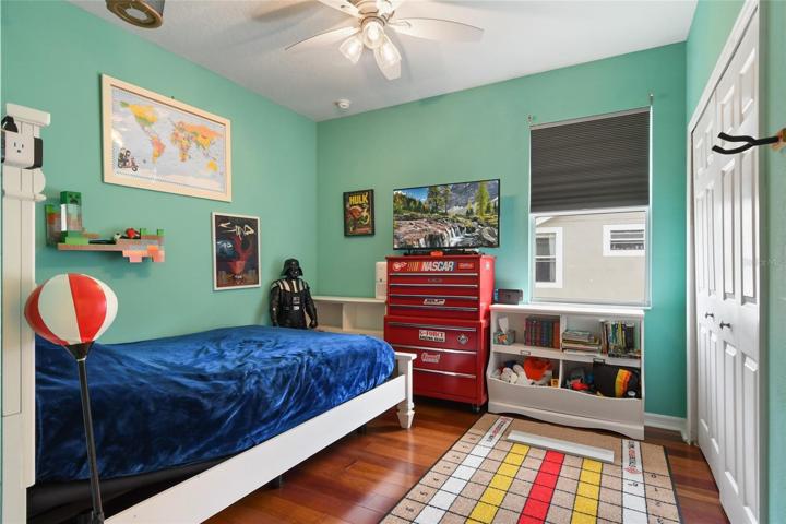 On the other side of Jack n Jill bath is second supporting bedroom, double closet, window treatment and ceiling fan complete this generous bedroom.