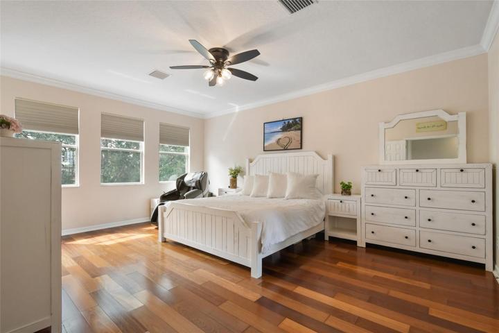 Spacious Master bedroom located on the second floor overlooking pool and water for a spectacular view.