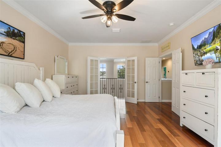 Note the double french door in the master bedroom overlooking the living area with a double door entry leading to the supporting bedroom hallway.