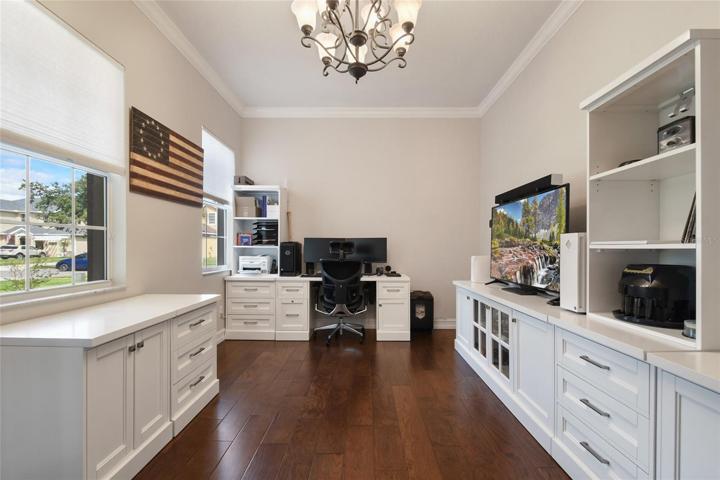 To the left of the front door is the dining room with abundant natural light. Currently used as an office/home schooling room. It features crown molding, 5 1/4