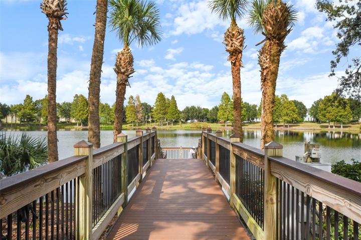 Expansive community dock leading to water view.