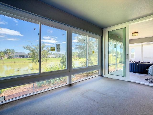 1 of 2 screened in back Porches facing Pond!